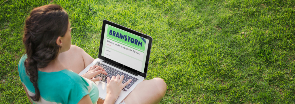 girl sitting at a laptop with a Google form titled brainstorm